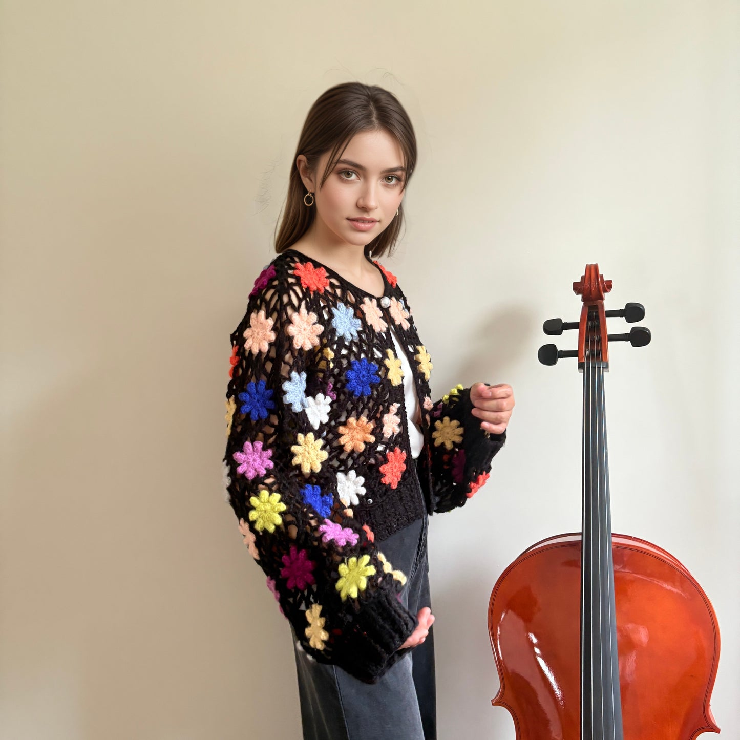 Hand-crocheted knit cardigan with three-dimensional woven flowers