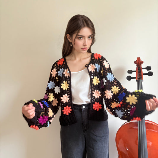 Hand-crocheted knit cardigan with three-dimensional woven flowers