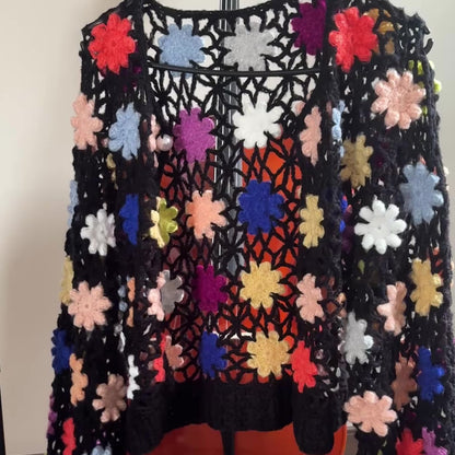 Hand-crocheted knit cardigan with three-dimensional woven flowers
