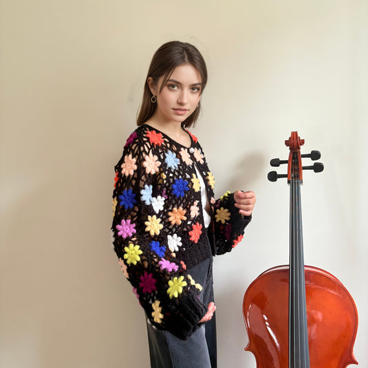 Hand-crocheted knit cardigan with three-dimensional woven flowers